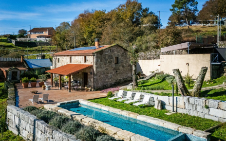 Parking area just beside with a ramp down to the house